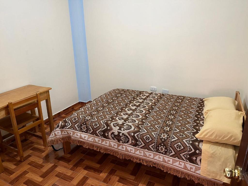Postel nebo postele na pokoji v ubytování Hospedaje Catalina