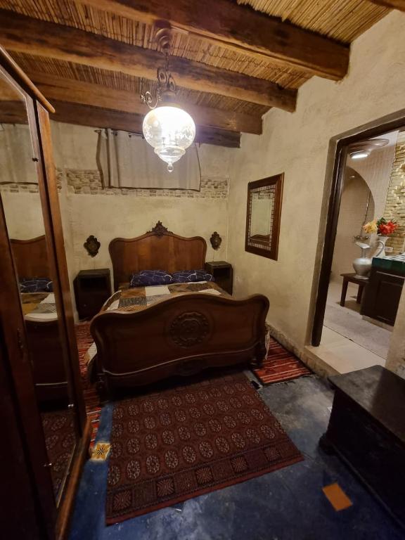 Postel nebo postele na pokoji v ubytování Dar El Sultan Tozeur