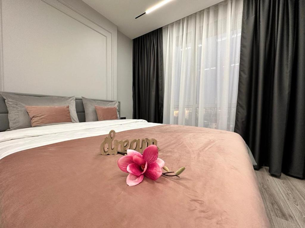Katil atau katil-katil dalam bilik di APARTMENT DELUX