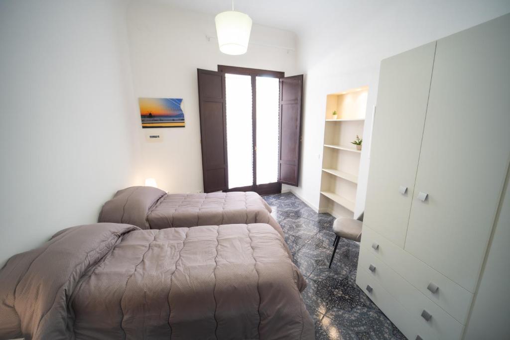 A bed or beds in a room at Al Corso 213