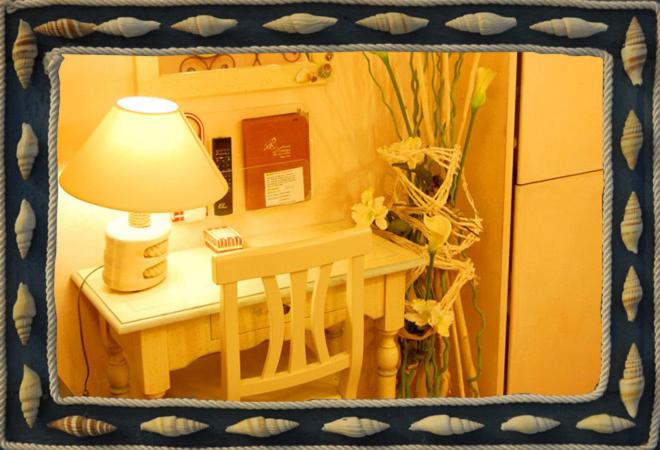 a picture of a table with a lamp on it at Hotel Marina in Monterosso al Mare