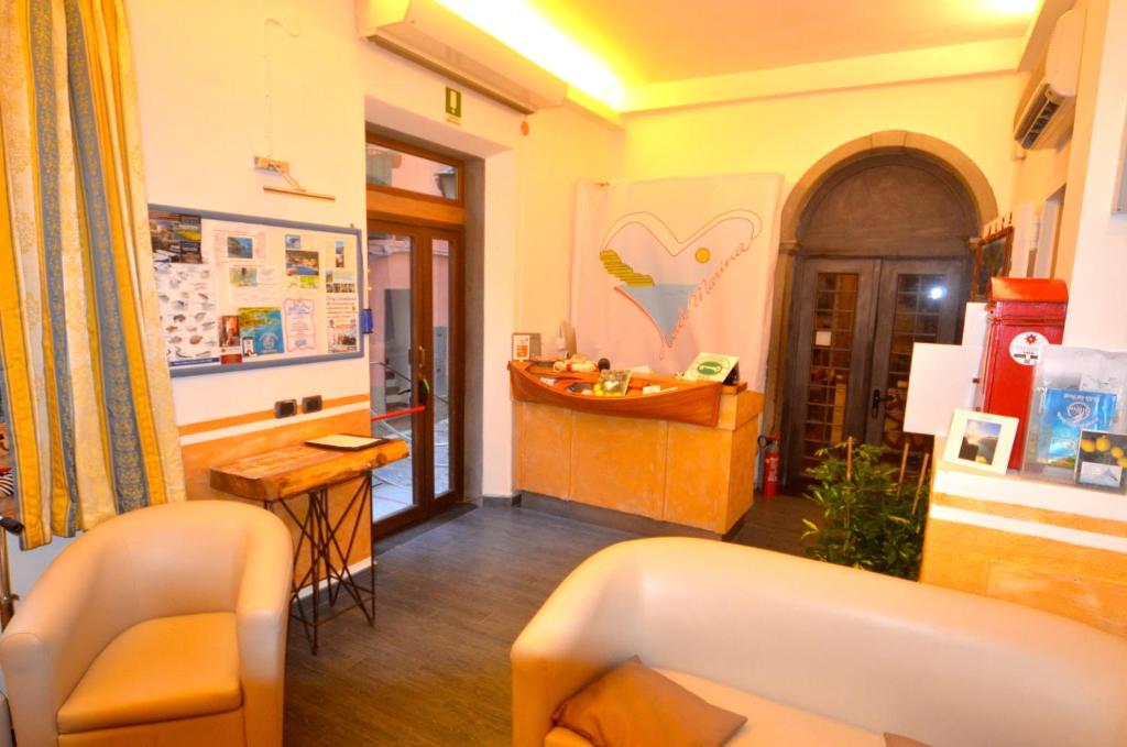 a room with a counter and a table in it at Hotel Marina in Monterosso al Mare