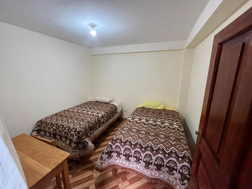 Postel nebo postele na pokoji v ubytování Hospedaje Catalina