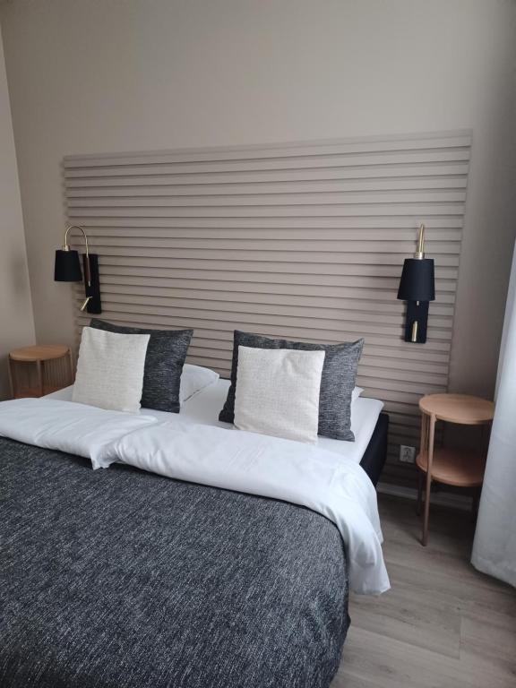 Postel nebo postele na pokoji v ubytování Moss Hotel & Apartments