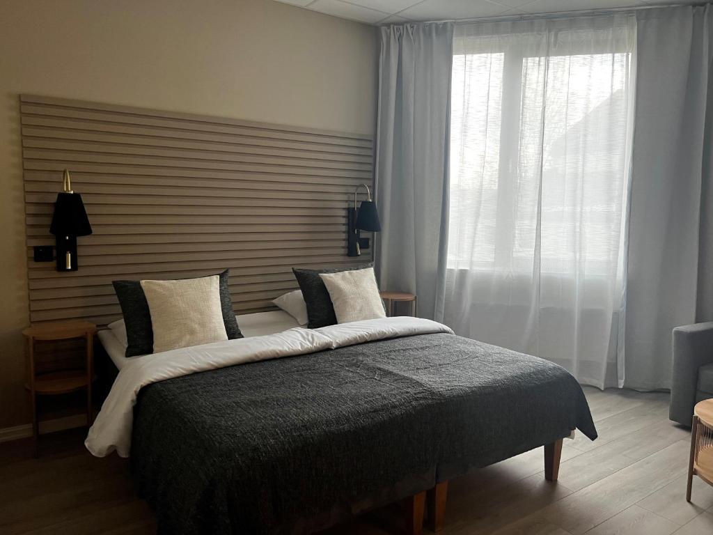 Postel nebo postele na pokoji v ubytování Moss Hotel & Apartments