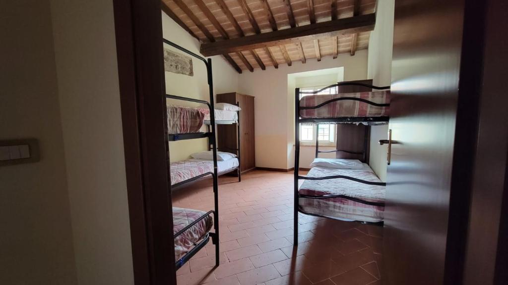 Postel nebo postele na pokoji v ubytování Locanda Francescana