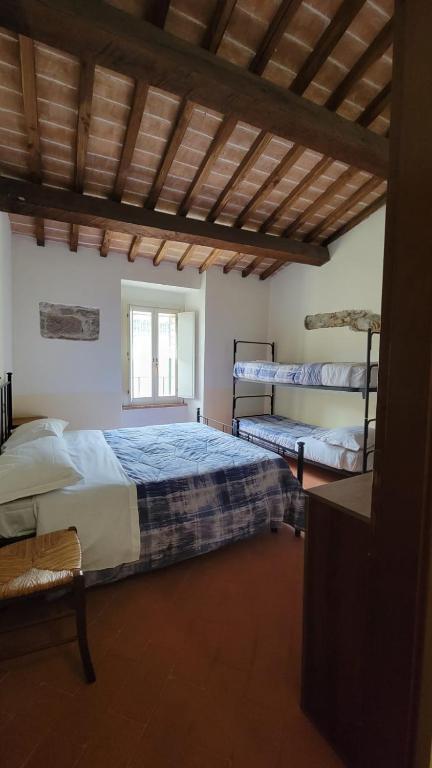 Postel nebo postele na pokoji v ubytování Locanda Francescana