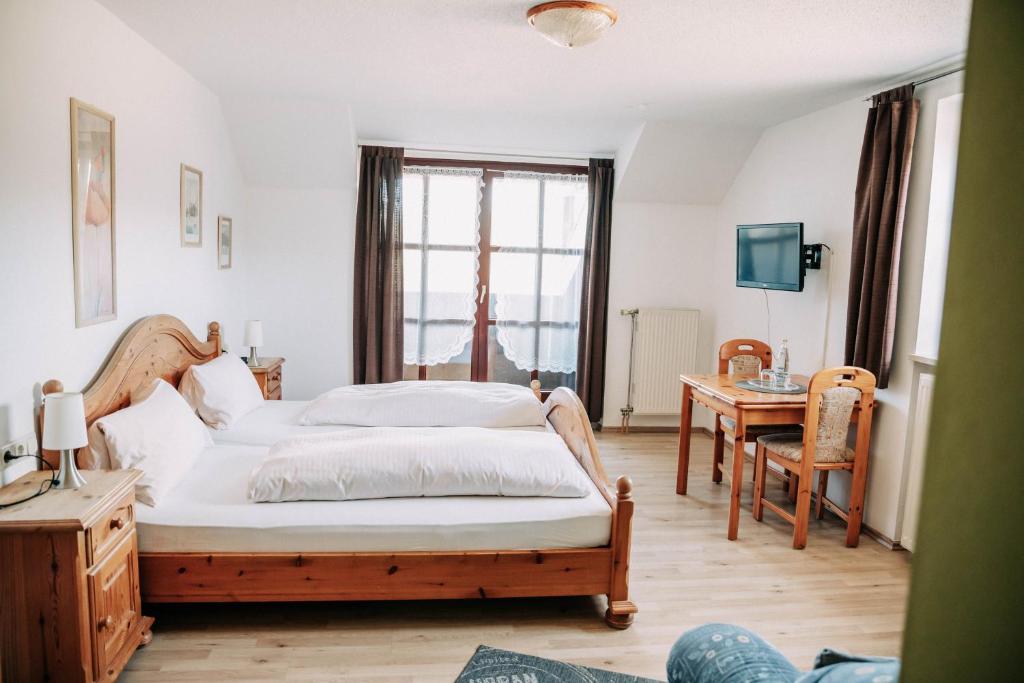 Postel nebo postele na pokoji v ubytování Waldpension Jägerstüberl