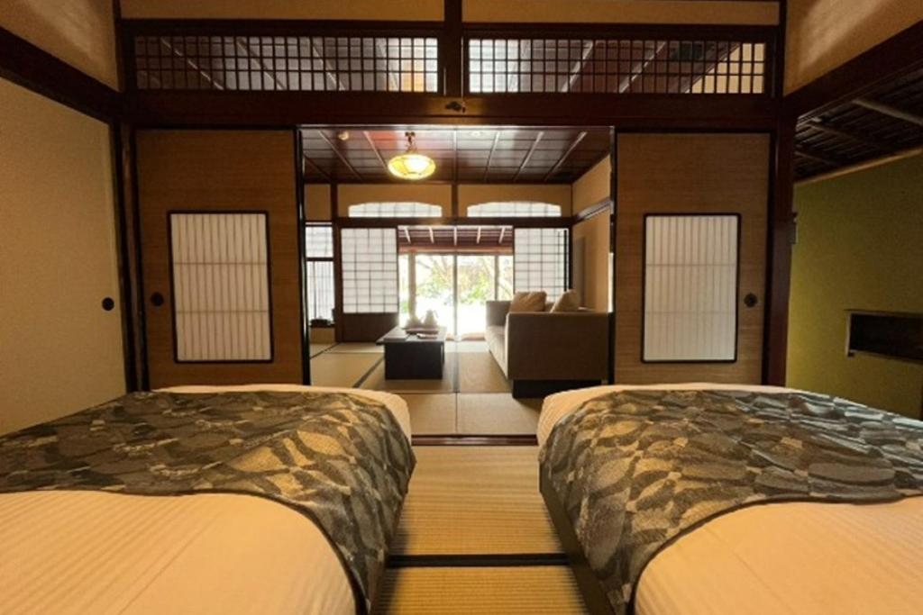 Una cama o camas en una habitación de Machi no Odoriba