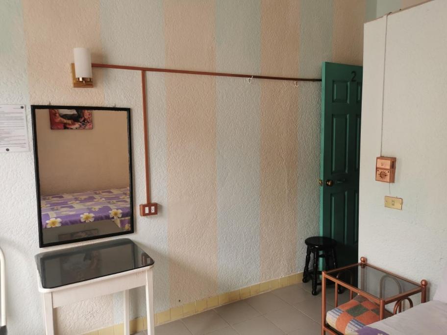Postel nebo postele na pokoji v ubytování HOTEL LIMÓN
