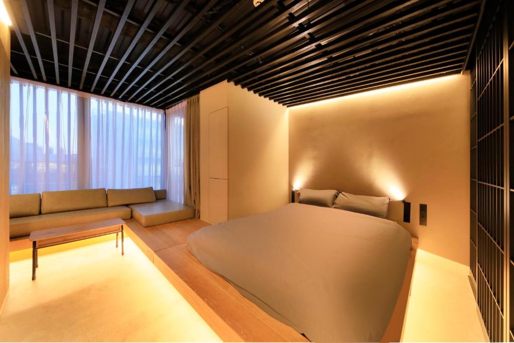 Postel nebo postele na pokoji v ubytování Amanecer Hotel