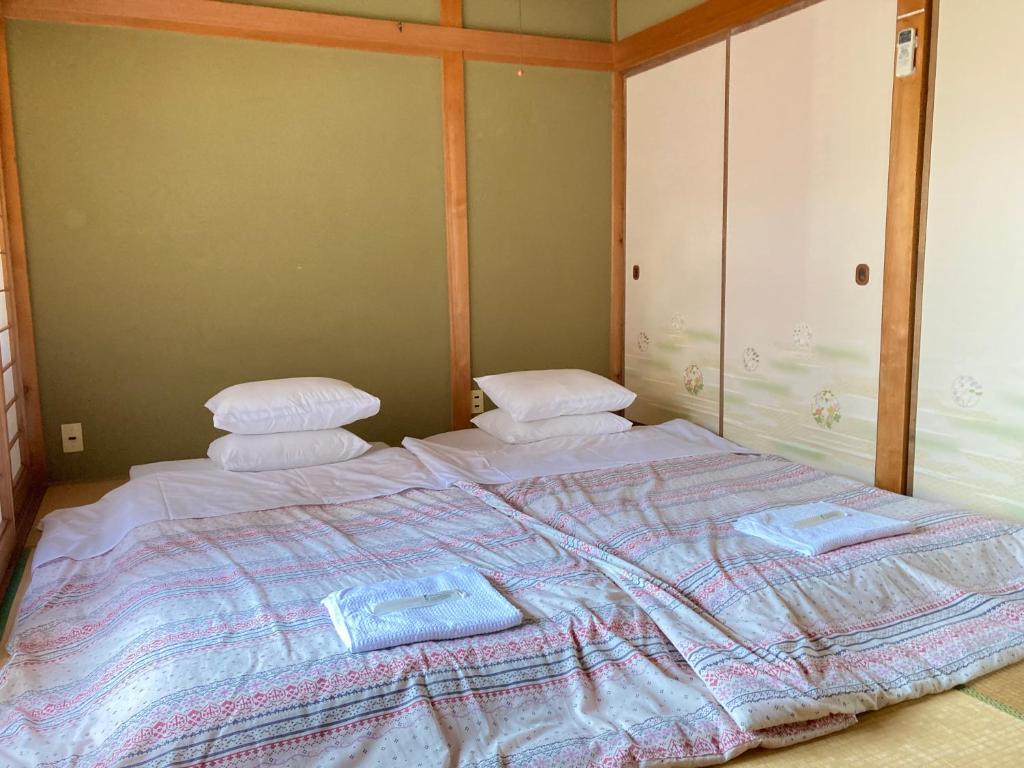 Postel nebo postele na pokoji v ubytování Guesthouse Namaste