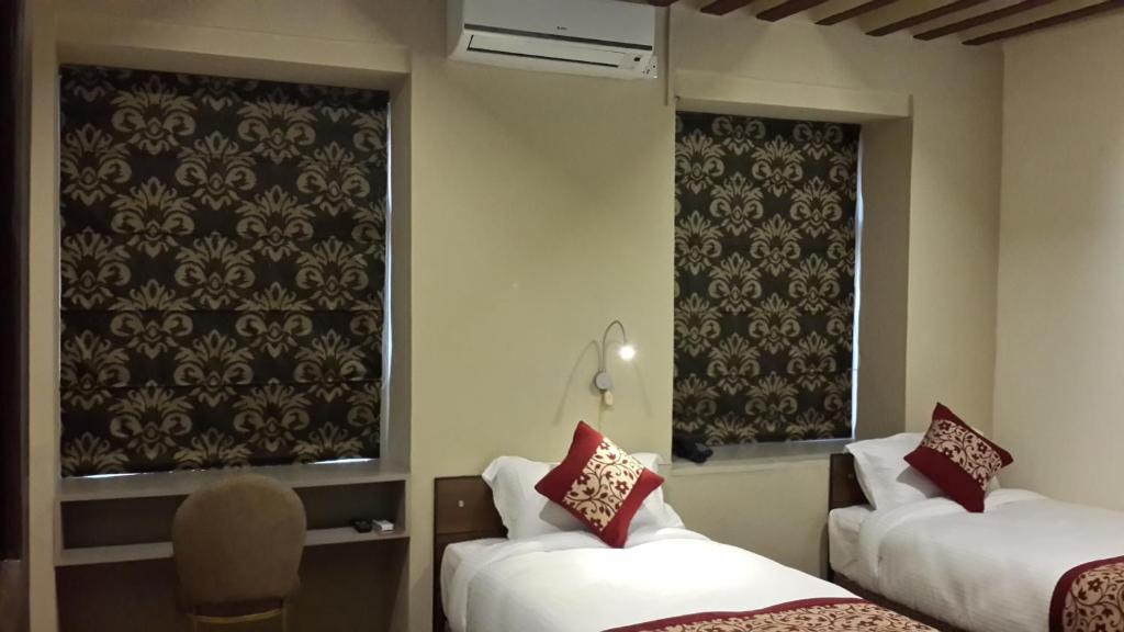 Postel nebo postele na pokoji v ubytování Hotel Heranya