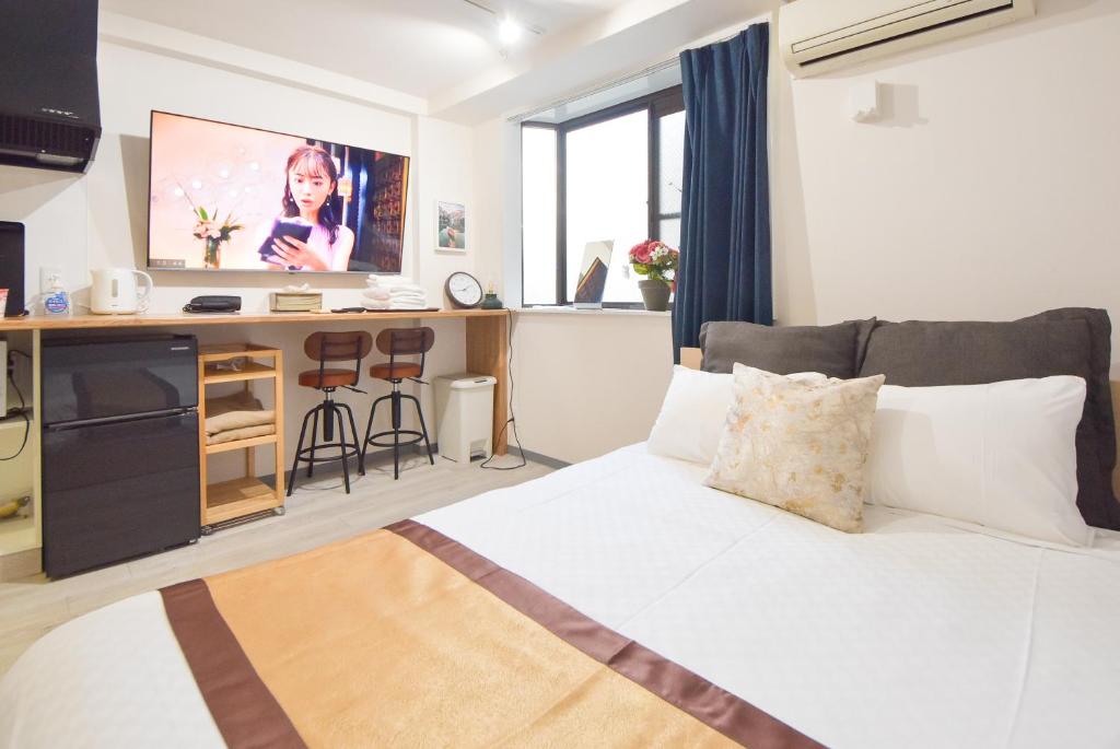 TV a/nebo společenská místnost v ubytování Comfy Stay Sakuramachi