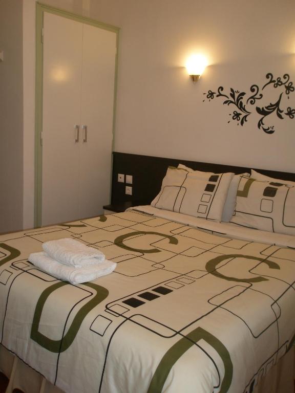 Postel nebo postele na pokoji v ubytování Galanopoulos Hotel
