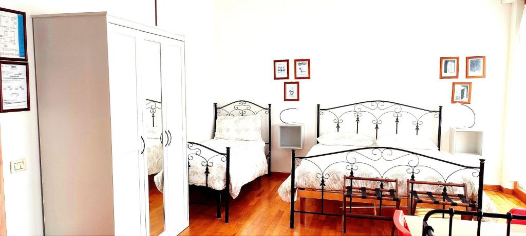 Postel nebo postele na pokoji v ubytování B&B L'Assiolo