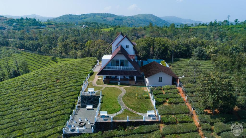 a house on a hill in a vineyard at The Highlander in Vagamon