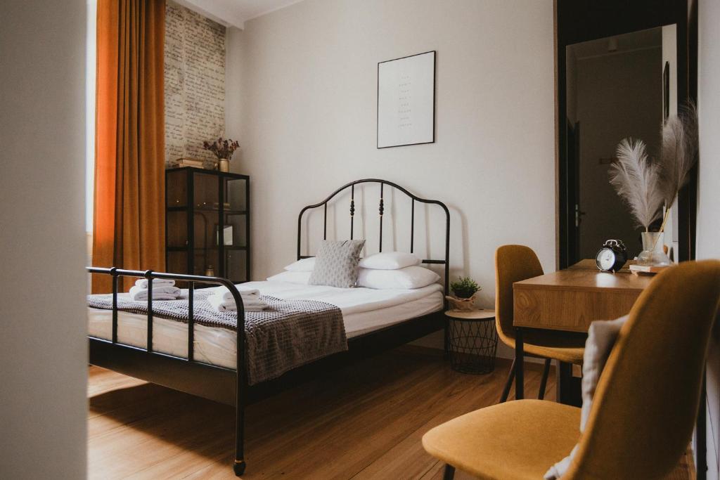 Katil atau katil-katil dalam bilik di Apartamenty Kamienica