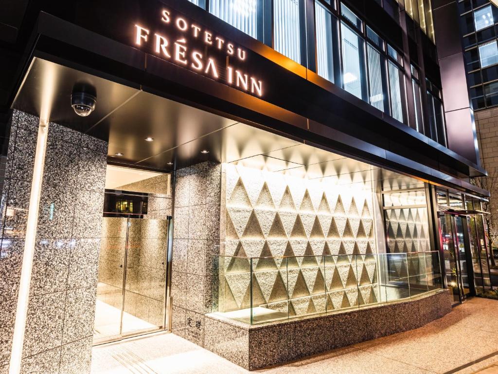 a store front with a sign that reads satisfied fresh inn at Sotetsu Fresa Inn Yodoyabashi in Osaka