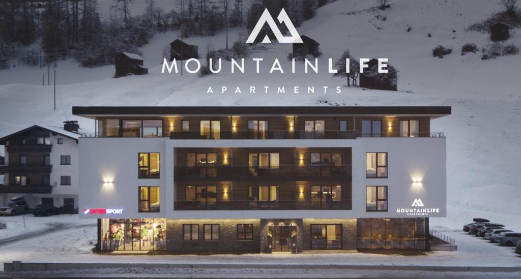 a mountain life apartment building in the snow at Mountain Life in Kappl