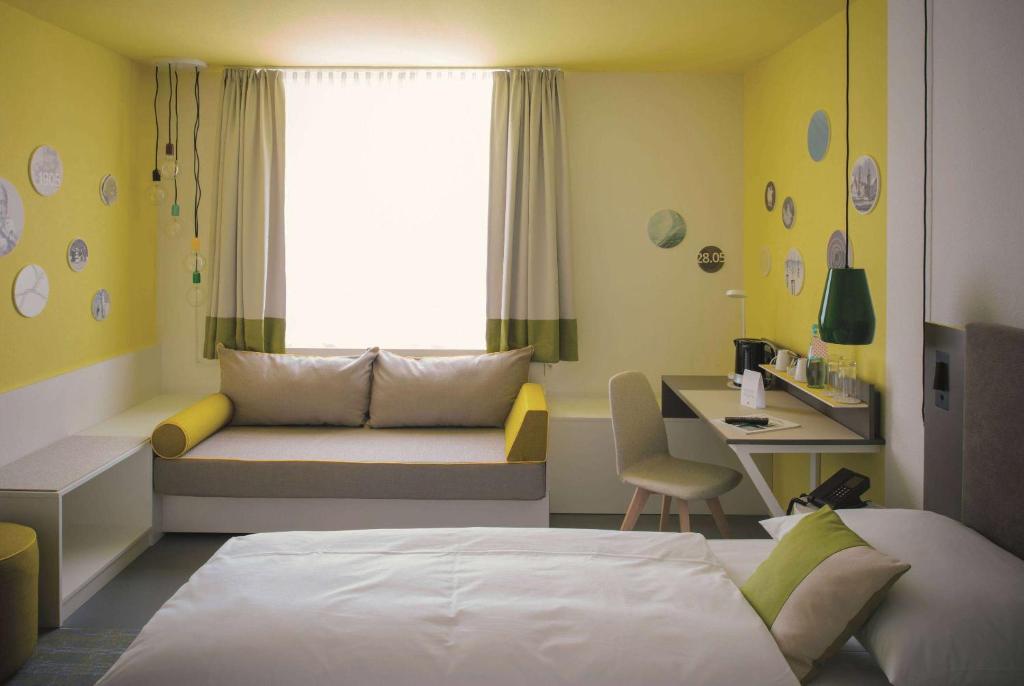 Postel nebo postele na pokoji v ubytování Vienna House Easy by Wyndham Landsberg
