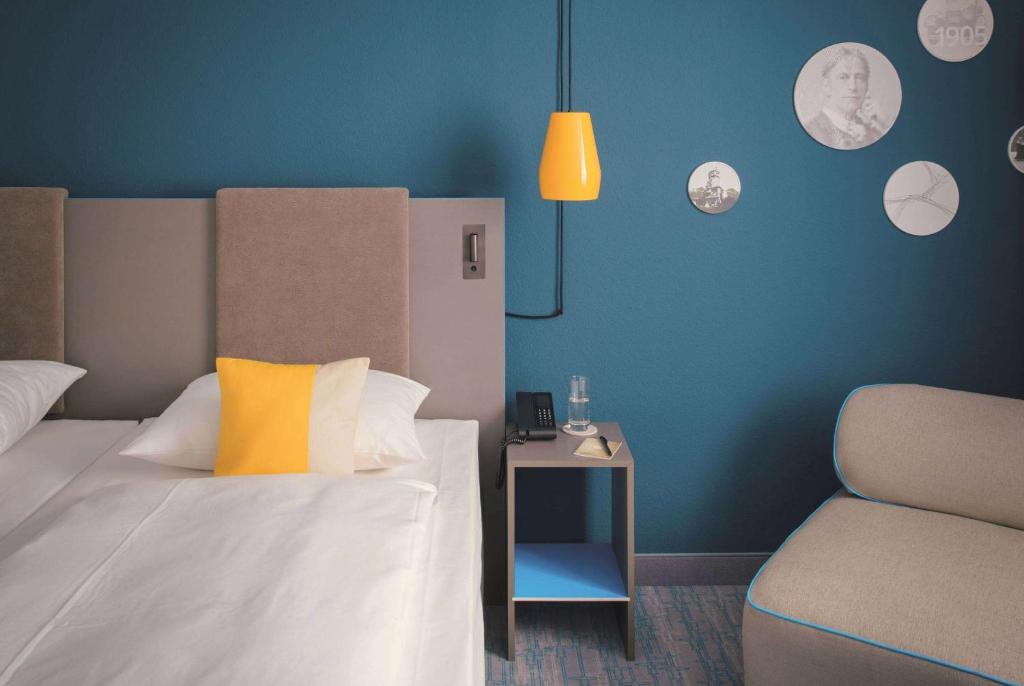 Postel nebo postele na pokoji v ubytování Vienna House Easy by Wyndham Landsberg