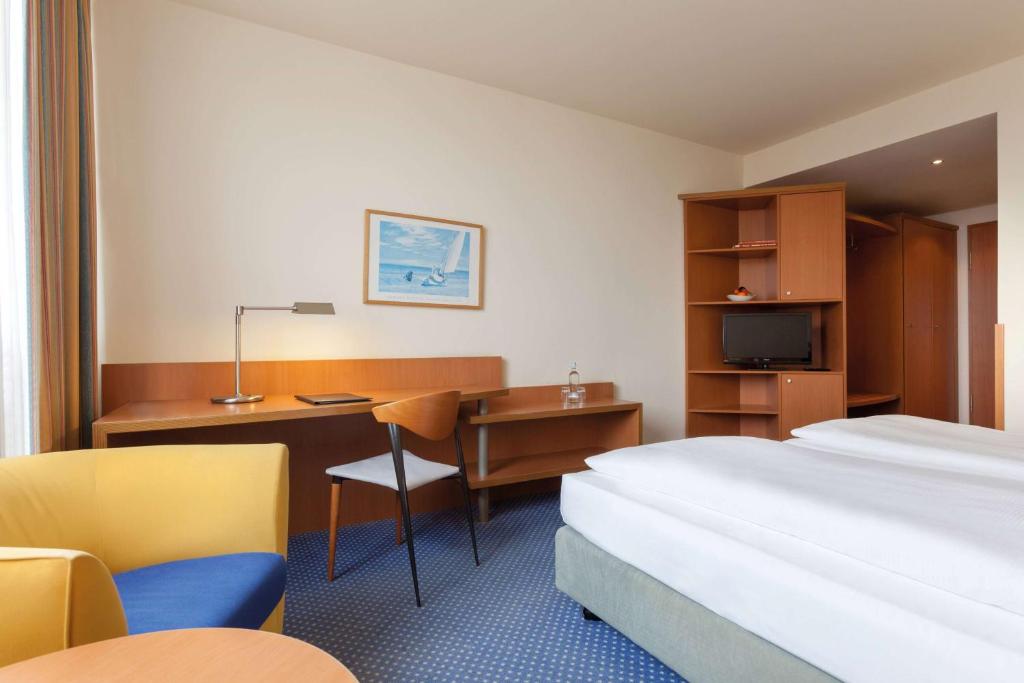 Postel nebo postele na pokoji v ubytování Vienna House by Wyndham Baltic Stralsund
