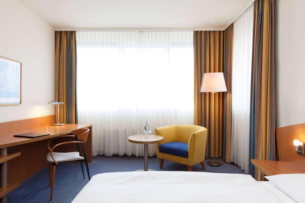 Postel nebo postele na pokoji v ubytování Vienna House by Wyndham Baltic Stralsund