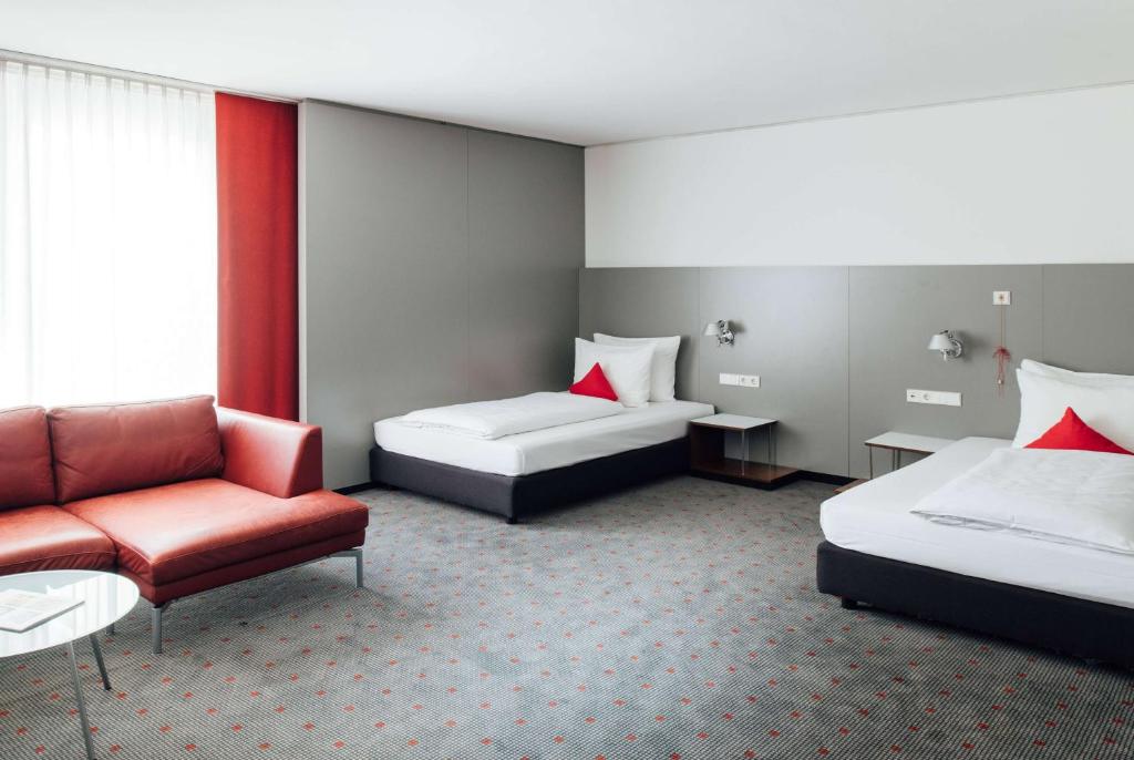 Postel nebo postele na pokoji v ubytování Vienna House Easy by Wyndham Stuttgart