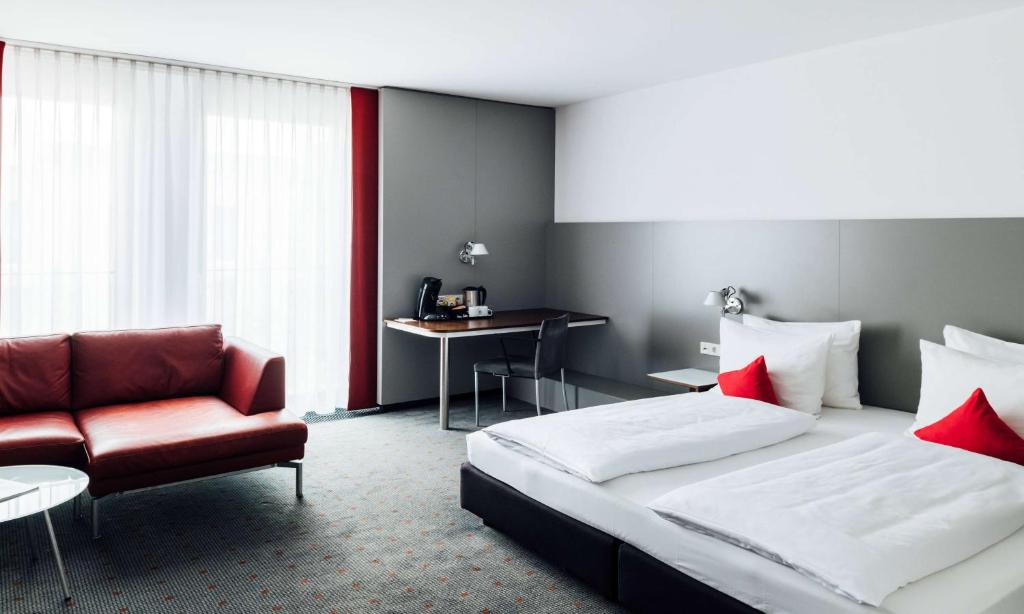 Postel nebo postele na pokoji v ubytování Vienna House Easy by Wyndham Stuttgart