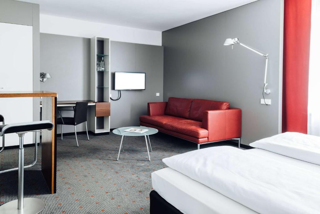 Postel nebo postele na pokoji v ubytování Vienna House Easy by Wyndham Stuttgart