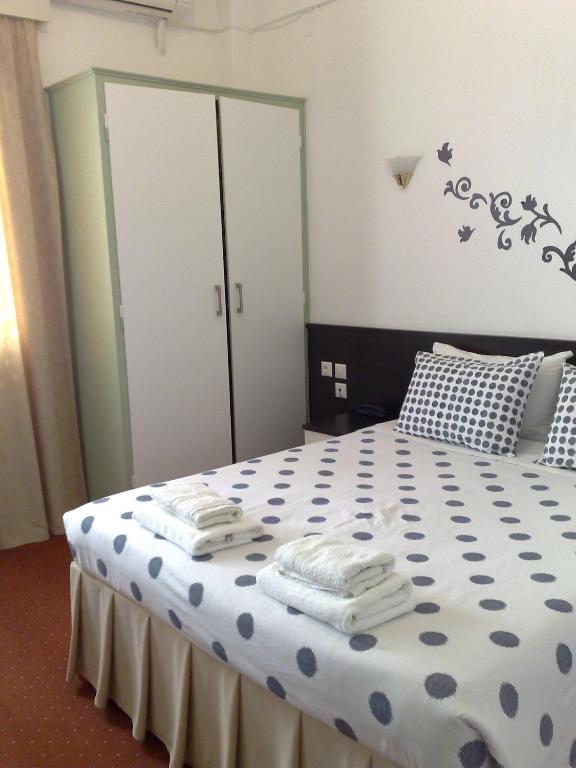 Postel nebo postele na pokoji v ubytování Galanopoulos Hotel