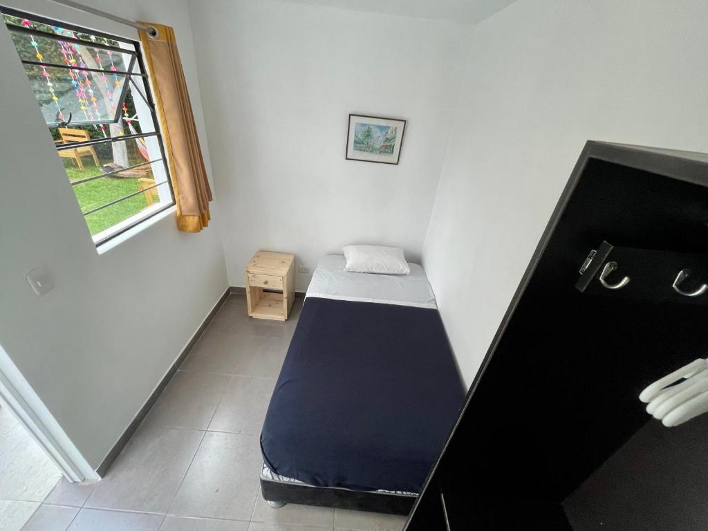 Postel nebo postele na pokoji v ubytování Casaroma Hostels