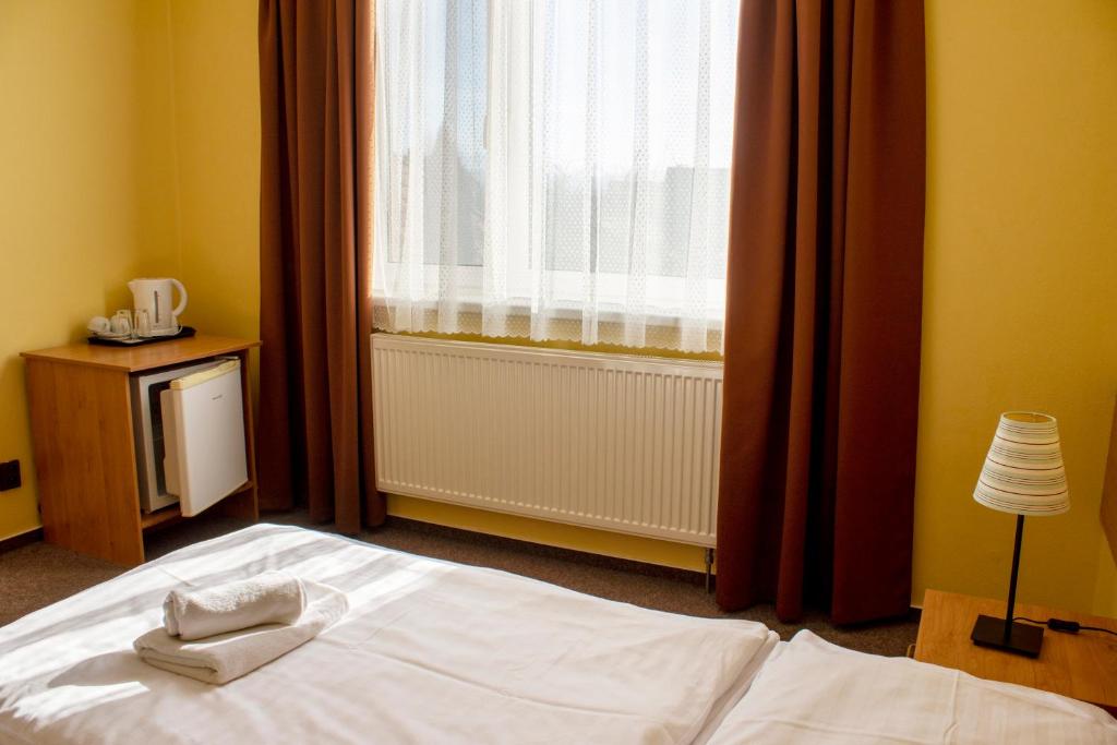 Postel nebo postele na pokoji v ubytování Penzión Bojnice