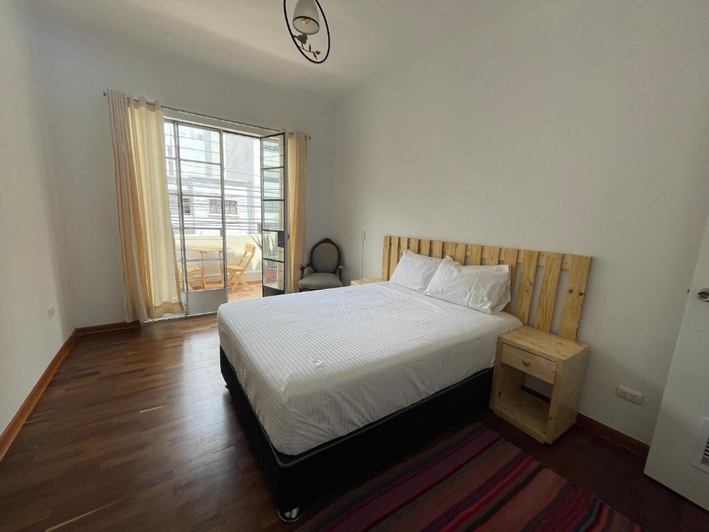 Postel nebo postele na pokoji v ubytování Casaroma Hostels
