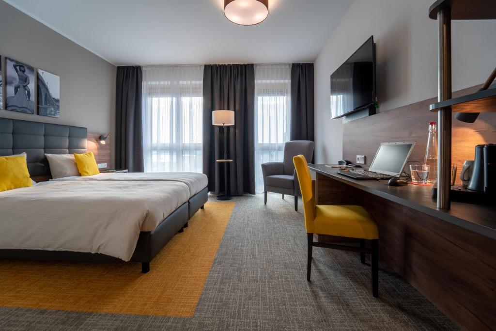 Postel nebo postele na pokoji v ubytování Hotel INCLUDiO