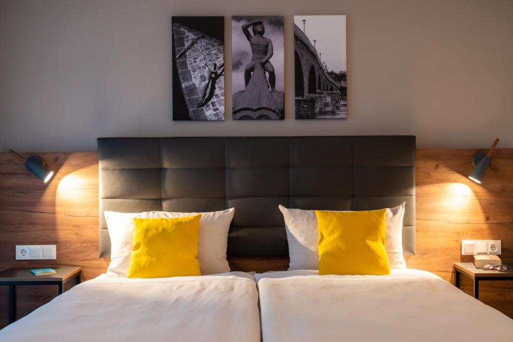 Postel nebo postele na pokoji v ubytování Hotel INCLUDiO