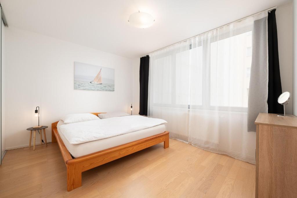 Postel nebo postele na pokoji v ubytování Mill Apartments