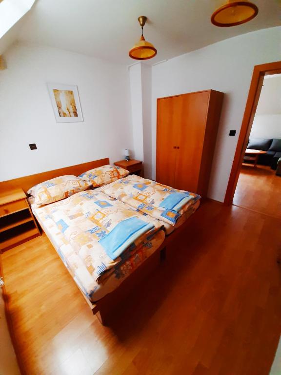 Postel nebo postele na pokoji v ubytování Apartmány Goral Oravice