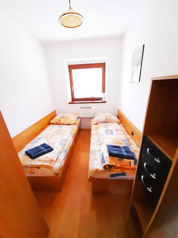 Postel nebo postele na pokoji v ubytování Apartmány Goral Oravice