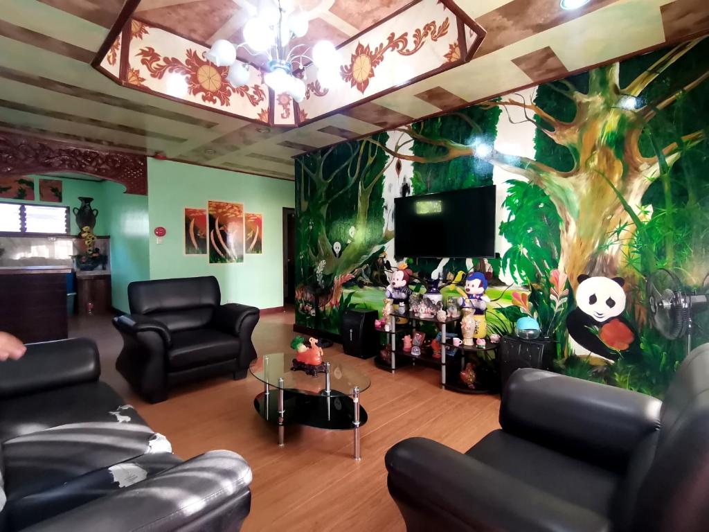 Posezení v ubytování CHISIPHIL Homestay Port Barton