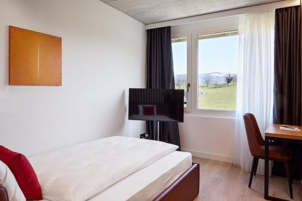 Postel nebo postele na pokoji v ubytování Tailormade Hotel RIGIBLICK Küssnacht