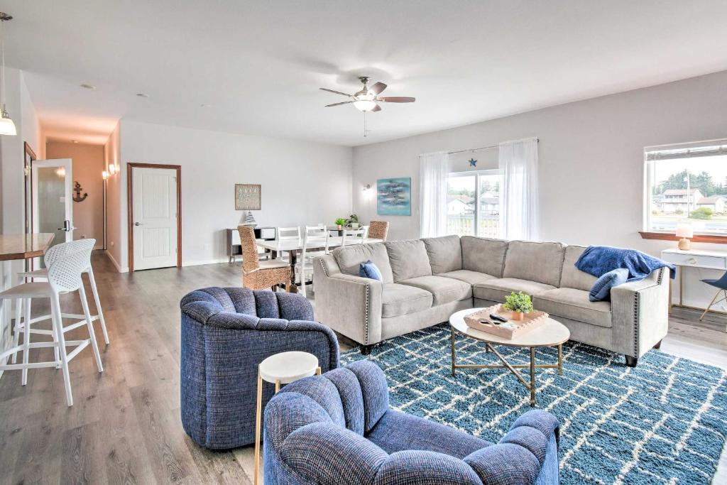 a living room with a couch and chairs and a table at Dog-Friendly Canalfront Condo in Ocean Shores in Ocean Shores