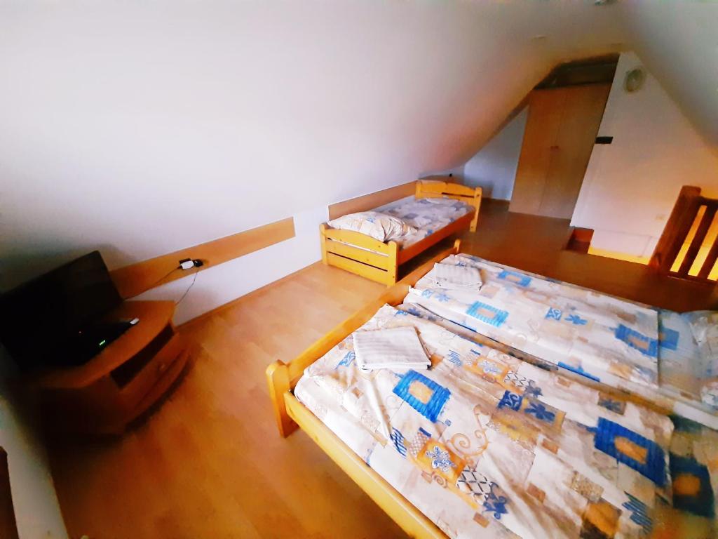 Postel nebo postele na pokoji v ubytování Apartmány Goral Oravice
