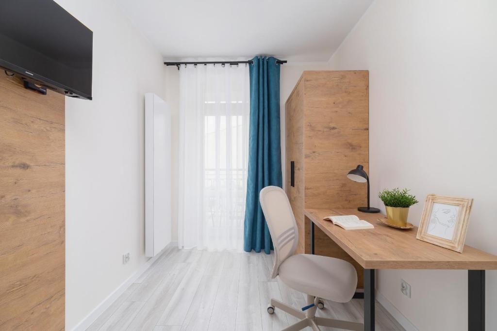 Televízia a/alebo spoločenská miestnosť v ubytovaní Modern Studio Cracow Rakowicka 14 by Noclegi Renters
