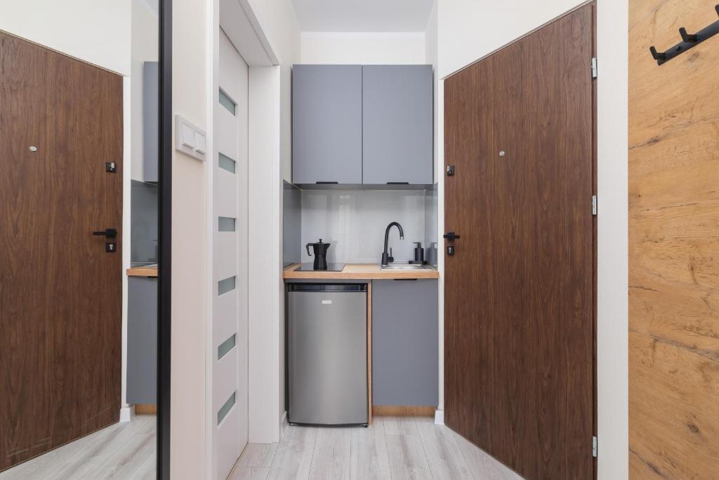 Kuchyňa alebo kuchynka v ubytovaní Modern Studio Cracow Rakowicka 14 by Noclegi Renters