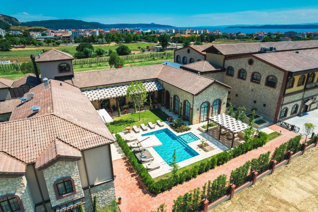 an aerial view of a house with a swimming pool at Bengodi Boutique Hotel in Eceabat