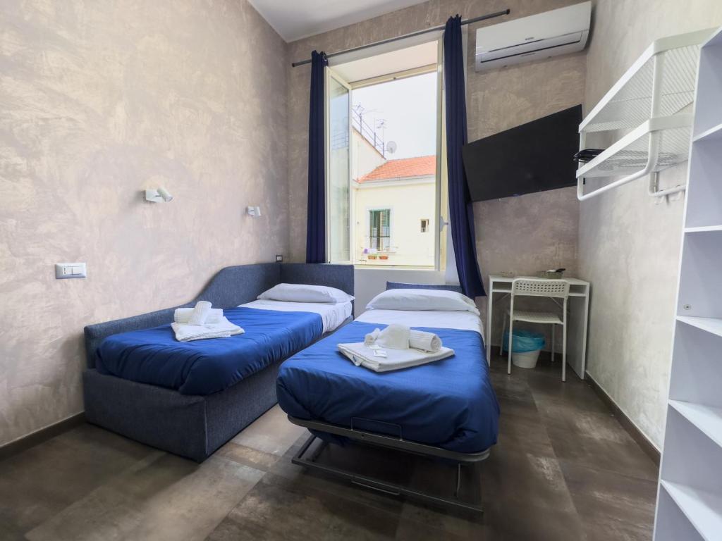 Łóżko lub łóżka w pokoju w obiekcie Dimora dei Sogni