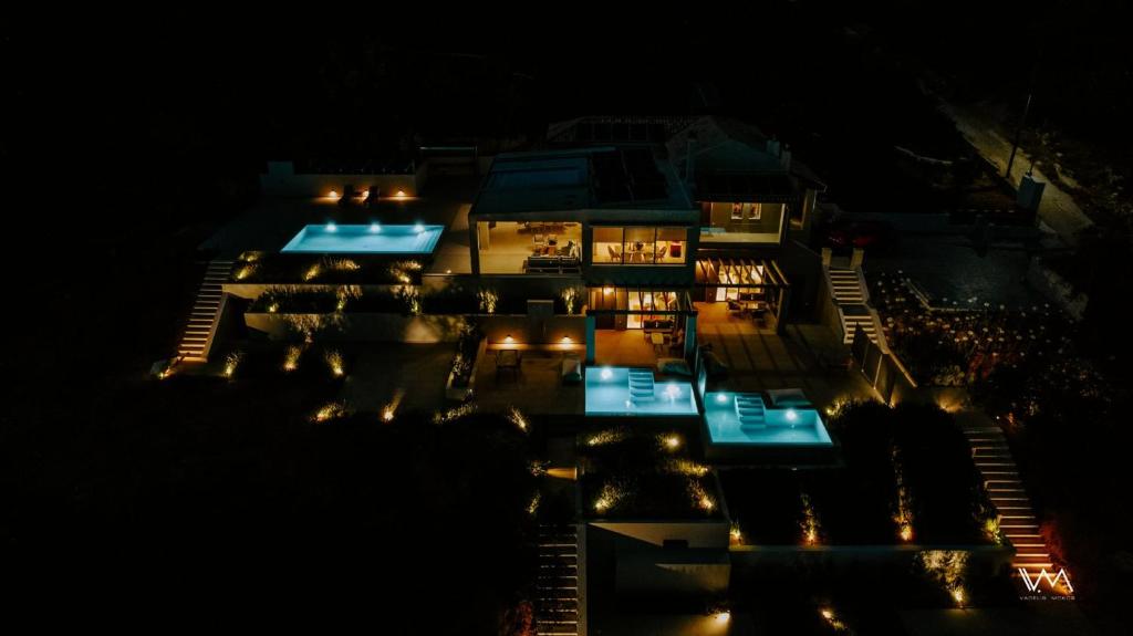 an aerial view of a building at night at Villas Elini in Perdika