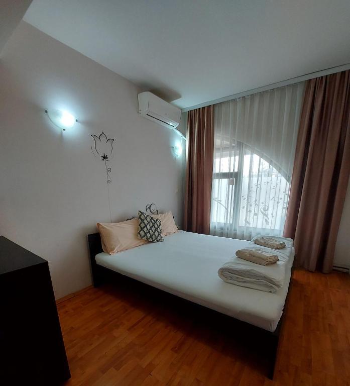 Postel nebo postele na pokoji v ubytování The Bulevard Hotel